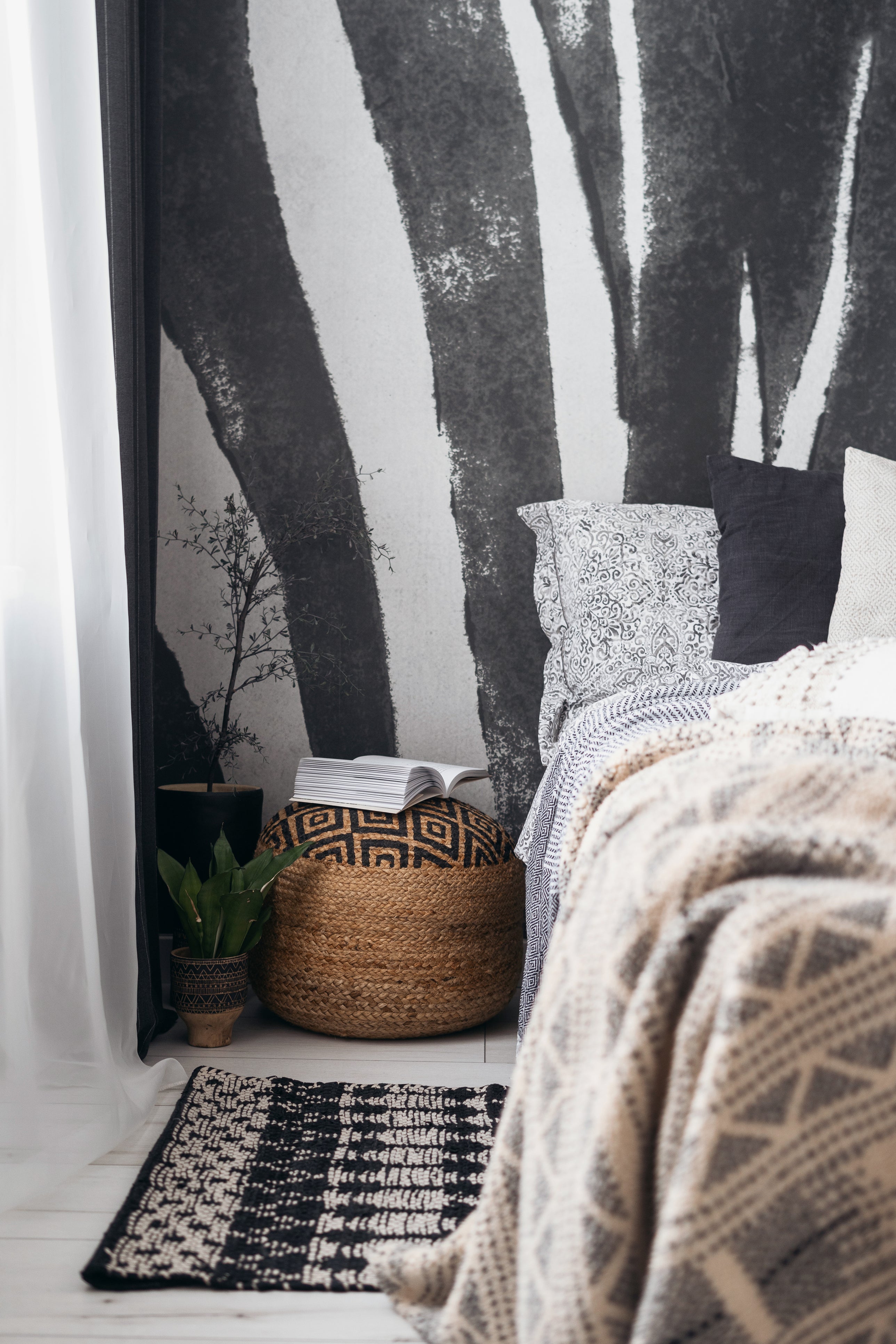 monochrome wall art and natural, textured bedding boho style